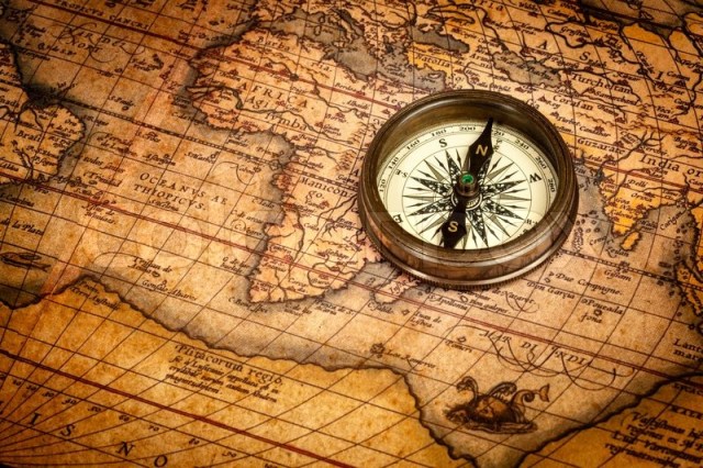 4214955-old-vintage-compass-on-ancient-map